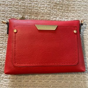 Poppy and Peonies Brand New Red Vegan Leather crossbody bag. Free clutch